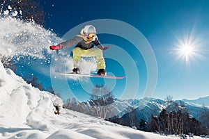 Girl is jumping with snowboard