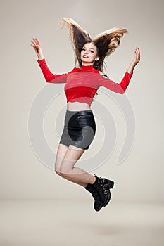 Girl jumping in studio