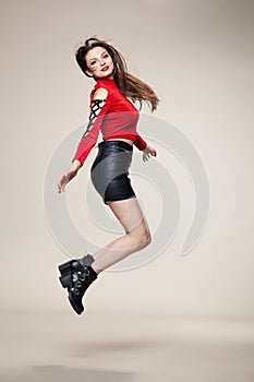 Girl jumping in studio