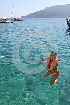 Girl jumping into the water