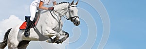 Girl jumping with white horse, isolated, blue sky, white clouds background.