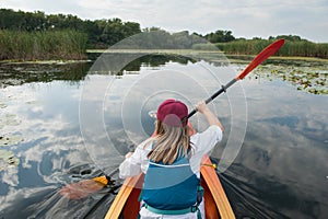 Girl in a kayak on a river