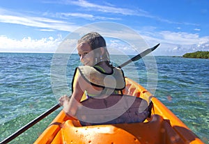 Girl kayaking in the caribbean