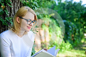 Girl keen on book keep reading. Bestseller top list concept. Woman blonde take break relaxing in park reading book. Girl