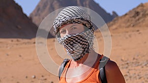 Girl in the Keffiyeh in Desert of Egypt.