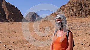 Girl in the Keffiyeh in Desert of Egypt.