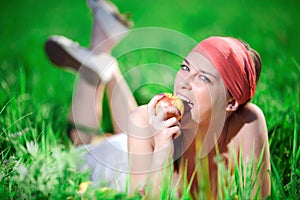 Girl in kerchief with apple