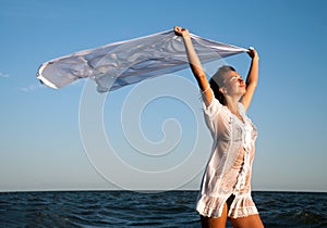 Girl with kerchief on the sunset