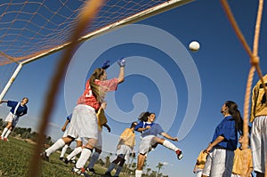 Girl Kicking Ball During Soccer Match