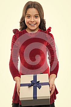 Girl kid hold birthday gift box. Every girl dream about such surprise. Birthday girl carry present with ribbon bow. Art