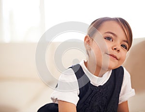 Girl kid, thinking or dream of future at home with questions, pensive and contemplating in living room. Thoughtful