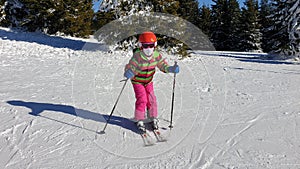 Girl kids skiing on montain snow photo