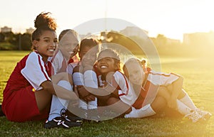 Girl kids, soccer field and team portrait together for competition, game and summer training outdoors in Brazil