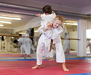 Girl in kimono exercising throws