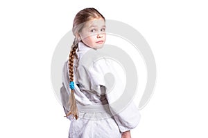 Girl in a kimono judo. In a fighting stance. Isolated on white background