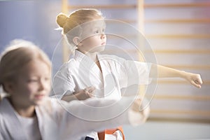 Girl in kimono practicing karate