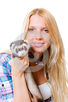 Girl kissing a ferret