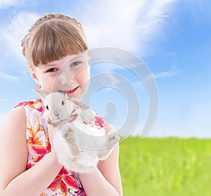 Girl kissing a rabbit