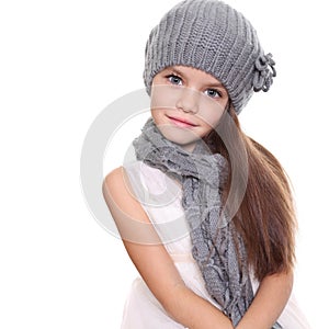 Girl in a knitted hat and gray scarf