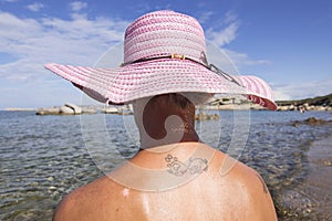 Girl on the La Licciola beach in Sardinia