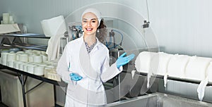 Girl in lab coat at dairy production process