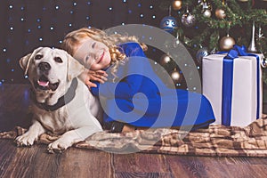 Girl and labrador dog, christmas concept