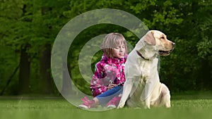 Girl with labrador retriever dog