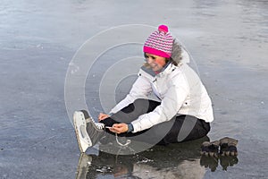 The girl in lace your skates on the ice.