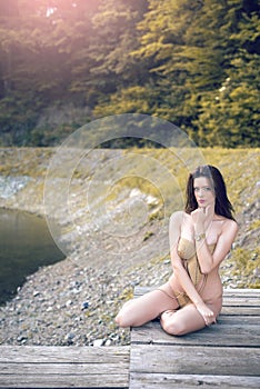GIrl on lake wearing monokini. photo