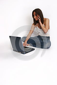 Girl with laptop and cellphone