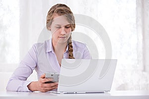 Girl with laptop and cellphone