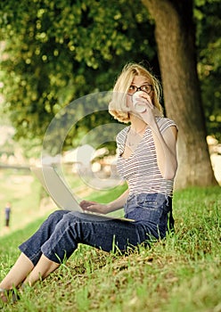 Girl laptop outdoors. Being outdoors exposes workers to fresher air and environmental variations making happy and