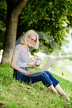 Girl laptop outdoors. Why employees need to work outdoors. Being outdoors exposes workers to fresher air and