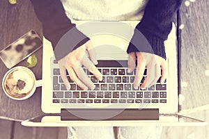 Girl with laptop, smartphone and cappuccino