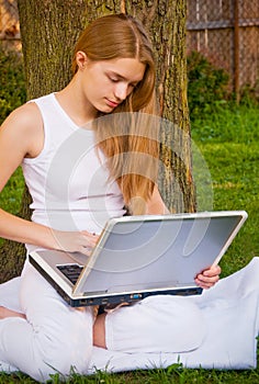 Girl on Laptop in Yard