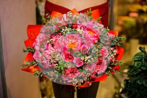 Girl with a large and bright bouquet of flowers for the Valentine s day