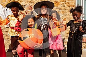Girl in large group of Halloween children