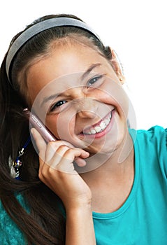 The girl is laughing and talking by phone