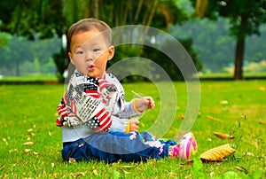 A girl on the lawn(Asia, China, Chinese)