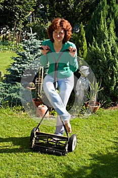 Girl with lawn mower