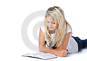Girl laying on the floor and reading book