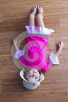 Girl laying on the floor and smiling