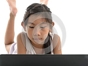 Girl laying on floor and using tablet