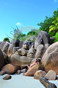 A Girl laying on granitic rocks