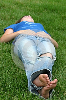 Girl laying in grass