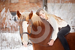 Girl laying on horse neck. Friendship background