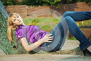 Girl lays near reservoir