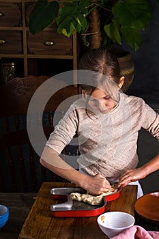 The girl lays out the dough