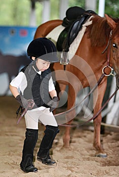 Girl leading a horse