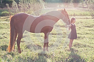 Girl leads her horse